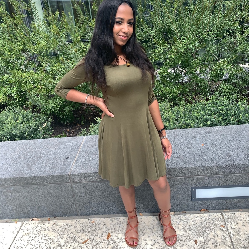 This is a dark green loose fitting dress